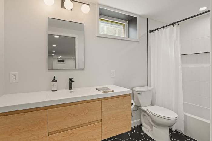 Oak floating vanity with built-in pulls — Minneapolis MN