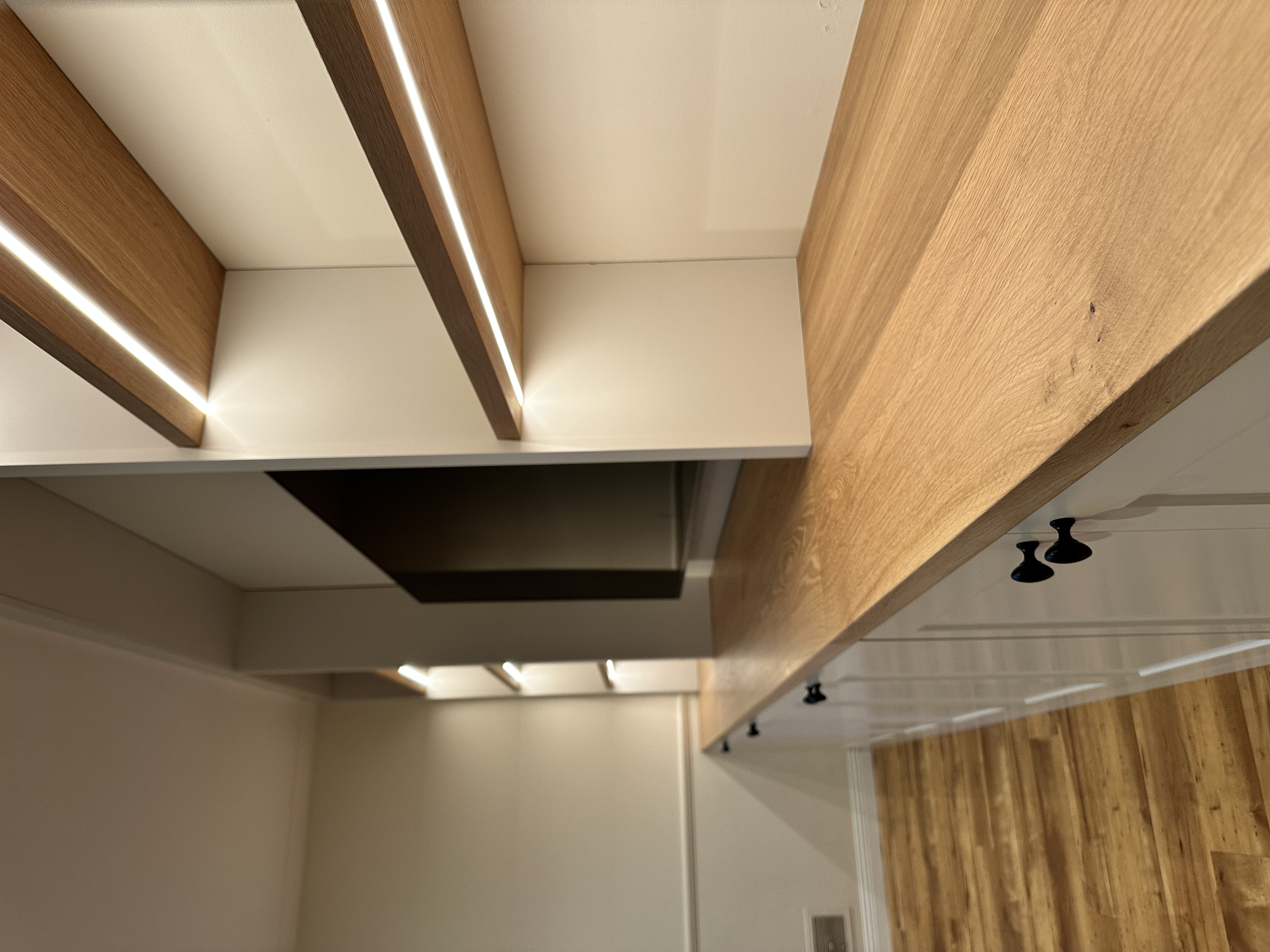 Rift-sawn white oak media wall with recessed LEDs — Edina MN